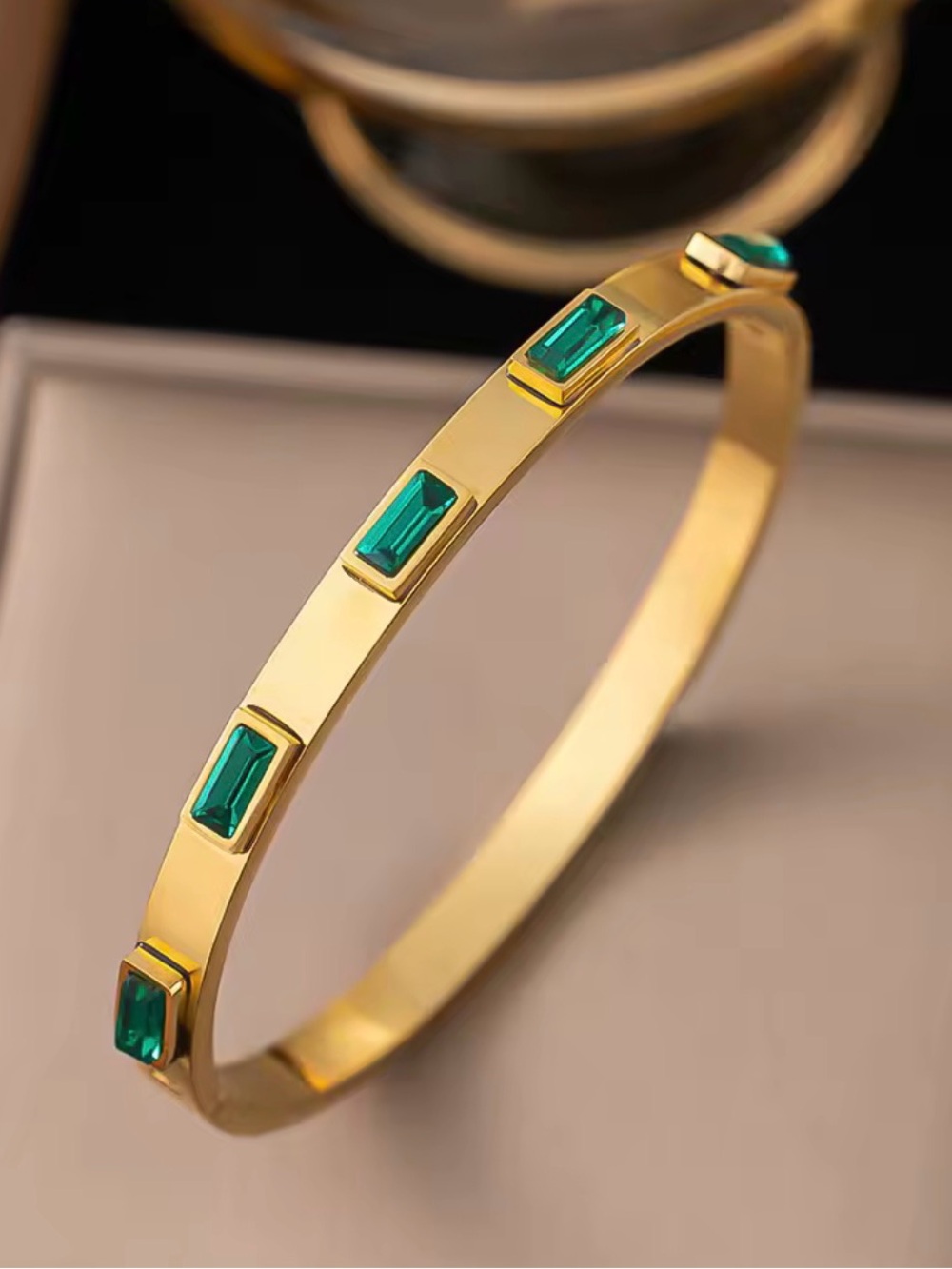 Gold Bracelet with Emerald Green Baguette Stones